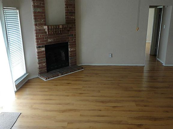 Nice and roomy living area with corner fireplace