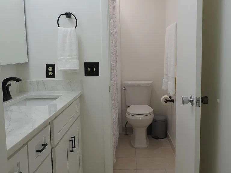 Shower and toilet separated from main bath in primary.