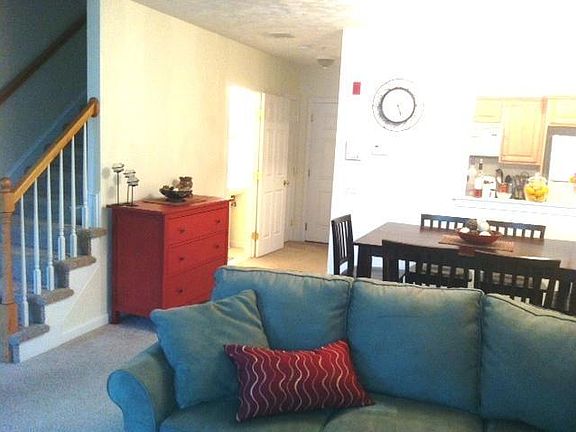 View of liv room, dining area and stairs to 2nd floor