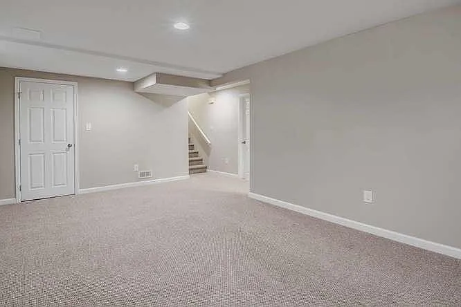 Lower level family room and stairs, closet on left
