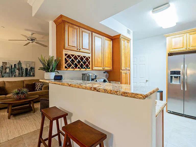 Upgraded Kitchen with Slab Granite and Stainless Steel Frigidaire Appliances