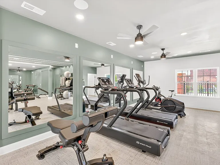 Spacious health and wellness center featuring professional-grade exercise equipment.