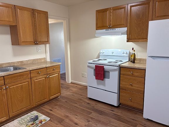 Kitchen with barnd new stove and fridge