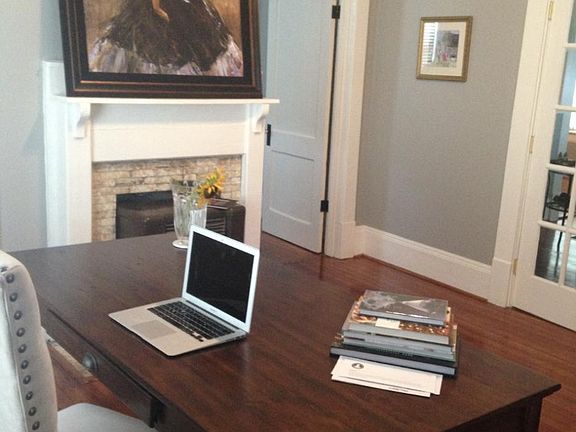 Front bedroom with operating gas log fireplace can be utilized as spacious office with French doors leading to the living room.