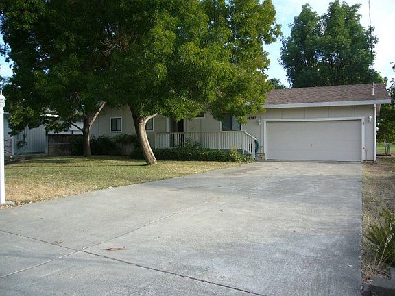 long driveway and deep front yard