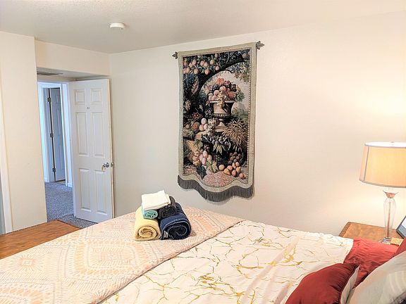 The entrance area of the room. Outside this room is a large living room with entertainment center, a pool table, a workstation, and a shared bathroom. A kitchenette with refrigerate is also on this level.