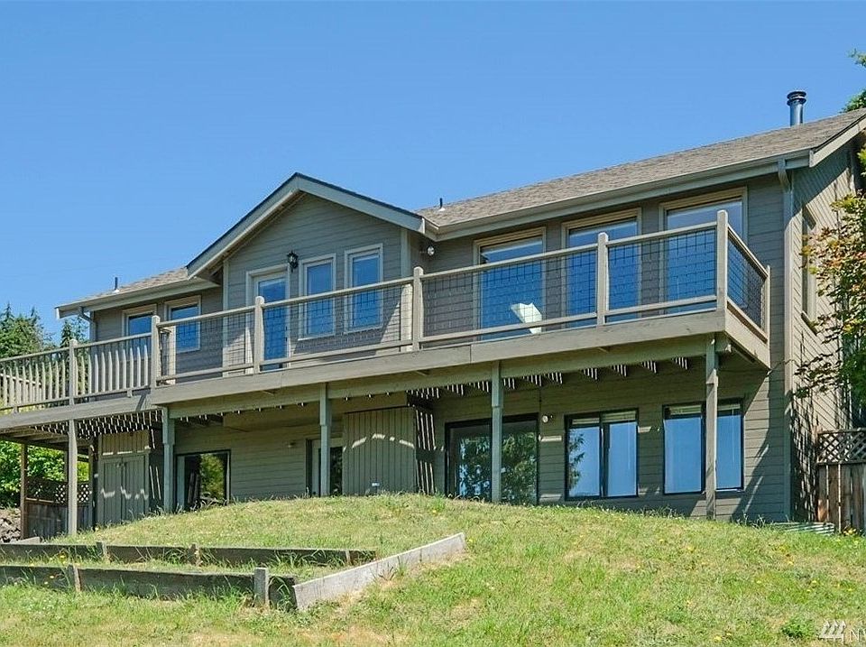 The west side of the home is almost all windows.  Water, mountains and territorial views.