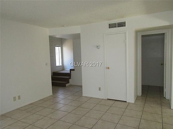 LIVING ROOM*DOOR TO ONE OF THE STORAGE CLOSETS