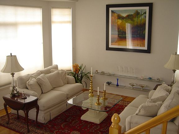 Large living room with BAY window and hardwood floors.