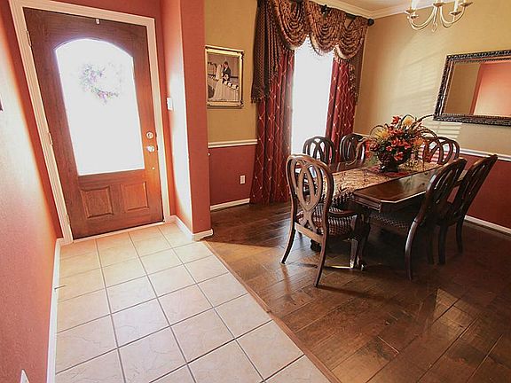 Entryway with tile floors and upgraded front door.