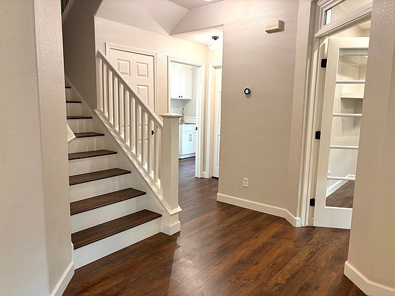 Staircase, Office/Den (4th Bedroom), Bathroom and Laundry Room. Garage Entrance.