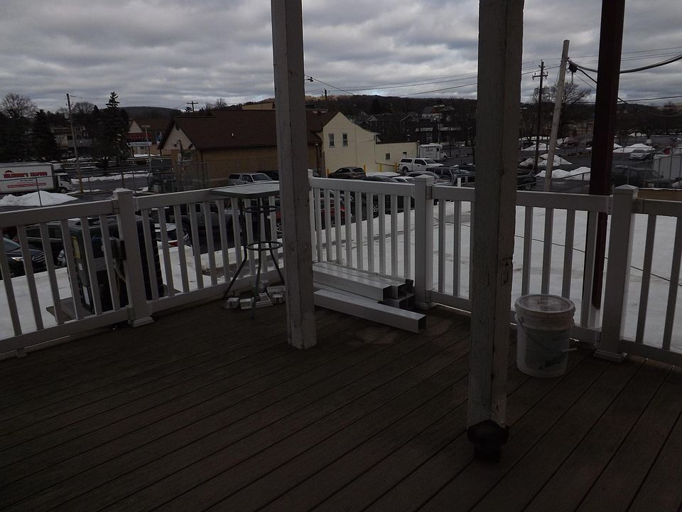 Deck outside Kitchen door - steps down to off-street parking lot.