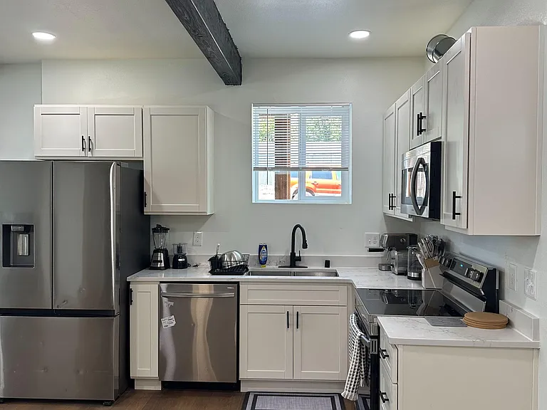 Updated kitchen with shaker cabinets, stainless-steel appliances, and plenty of counter space for everyday cooking.