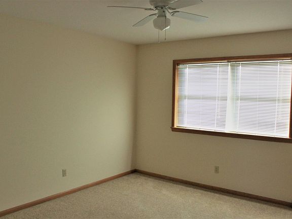 Bedroom with window view and ceiling fan