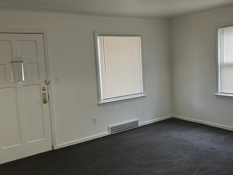 Spacious living area with natural light and clean, neutral finishes throughout.