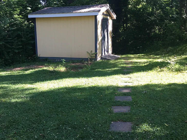 flat space between house and shed