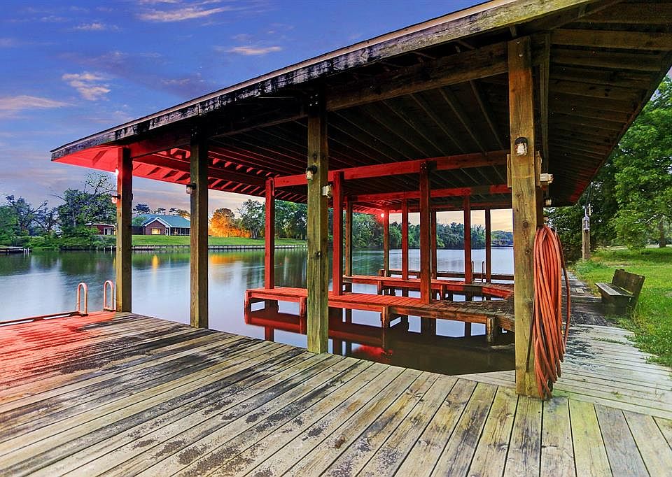 There is time to move in for your Memorial Day Festivities! Your very own covered boathouse with 3 slips. Current owners used for two boats and two jet skis.