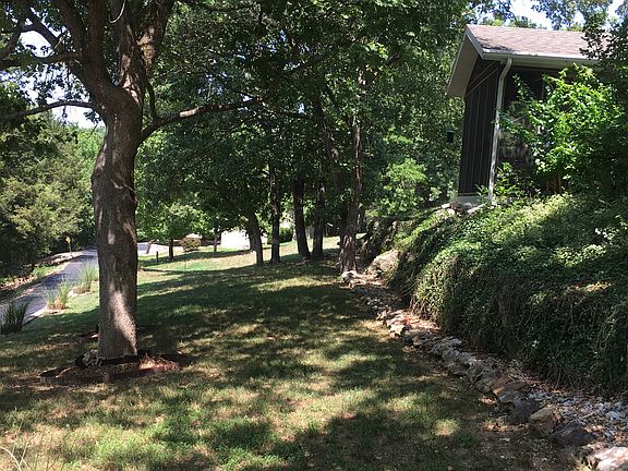 Yard facing lake.