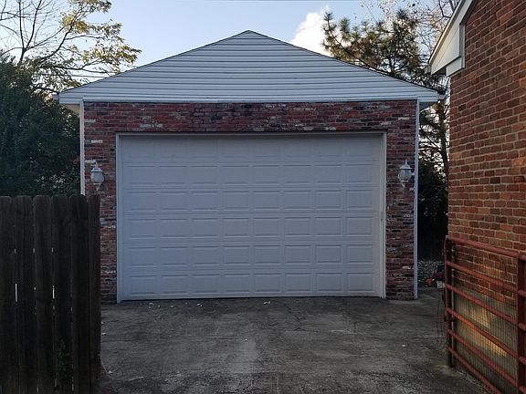 2 car garage w special interior lighting, and belt operated garage door opener.