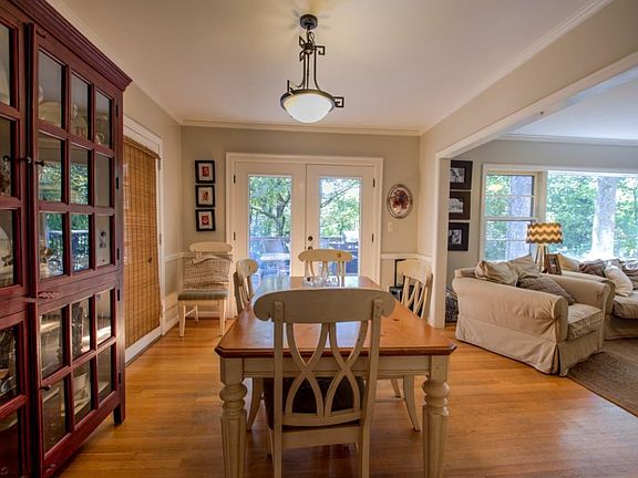 Dining room with double doors lead to patio. Office in a room next to the dining room overlooks back yard