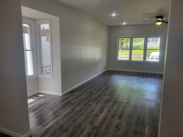 Living room is open to stairs and has tons of natural lighting!