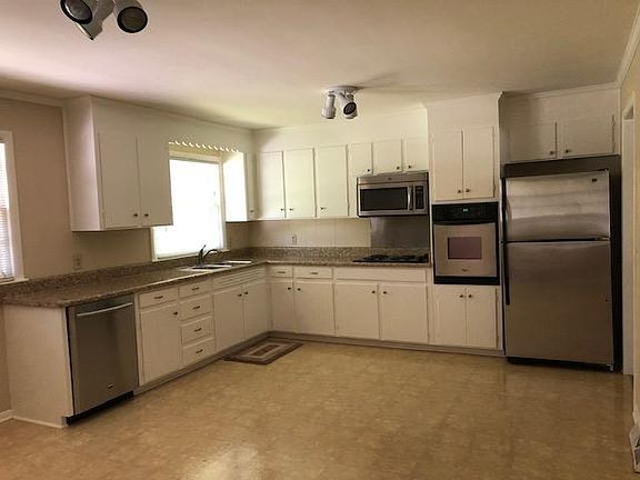 Large open kitchen to have dining area or sitting area..... New Dishwasher and oven. Just off the den where you can watch the children play or be with family....