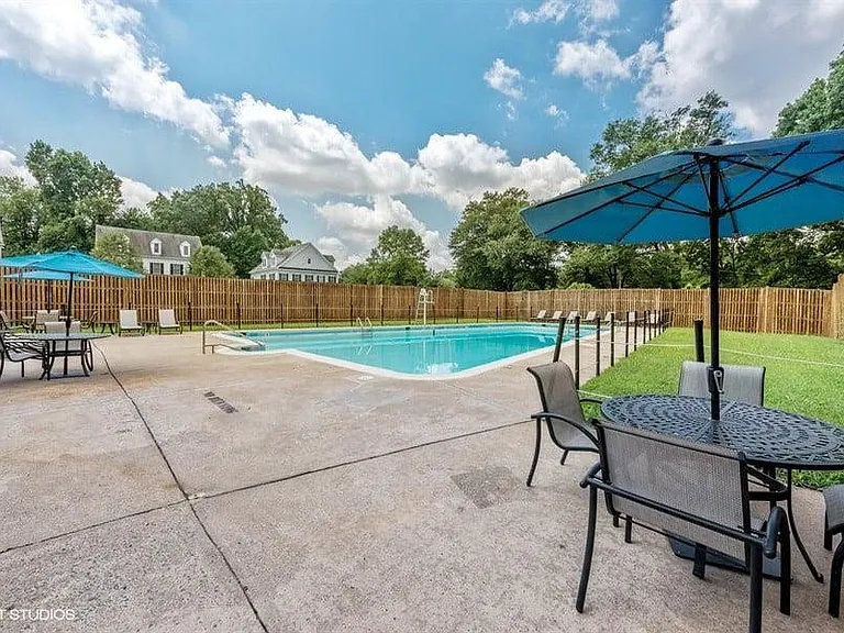 Outdoor Pool with Lounges and Tables