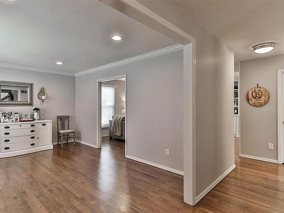 View from foyer looking into living room.  Refinished hardwood floors throughout main level