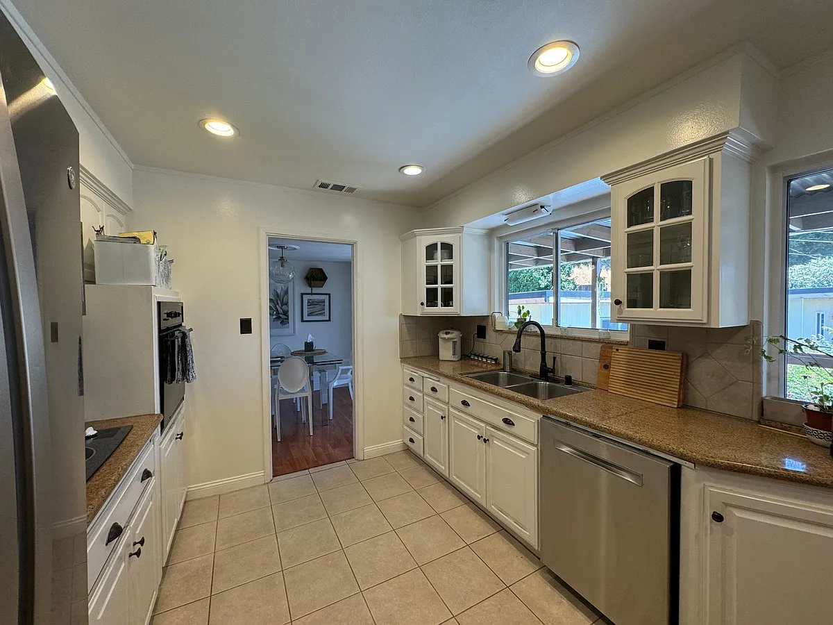 Kitchen with stainless steel appliances - 14770 McVay Ave