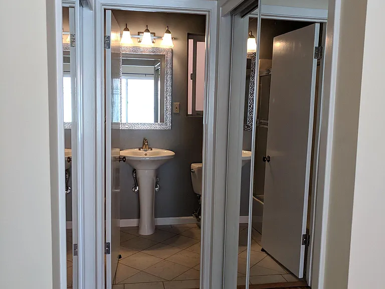 Hallway w/ Mirrored Closets on both sides