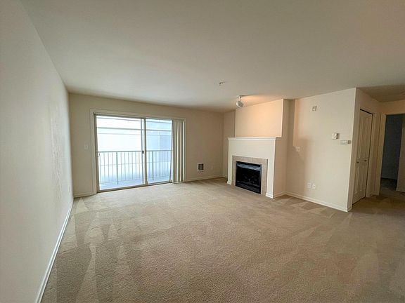 Comfortable living room with electric fireplace.