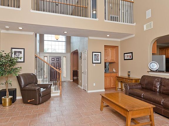 Shot from the rear of the den back towards the front door.