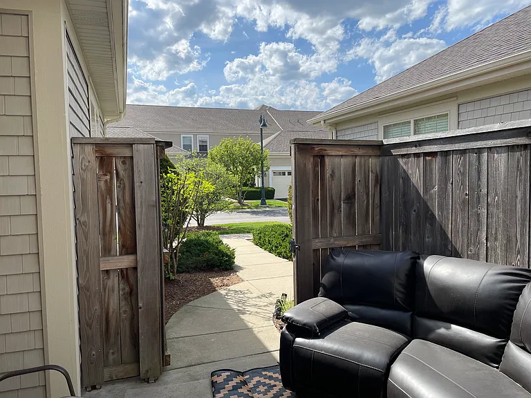 View at the small backyard fensed patio