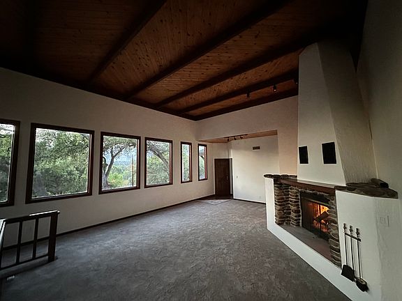 Beautiful cozy grand fireplace with internal ducting with fan to heat up the home with warm air from the fireplace.