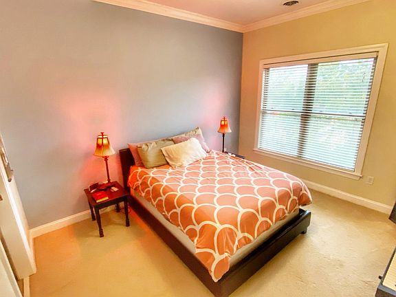 The first bedroom has a queen-sized bed.