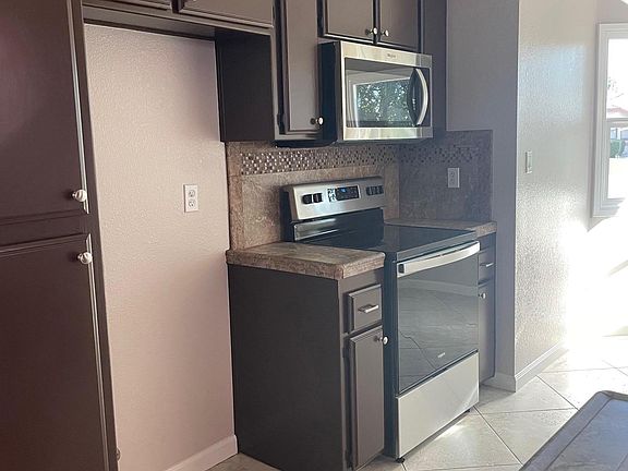 freshly painted cabinets and new SS appliances.