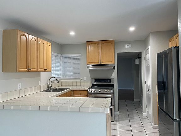 New refrigerator and recently replaced stove.