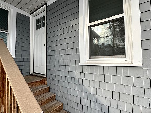 Second floor entrance from the rear of the property where there is two off street parking spaces.