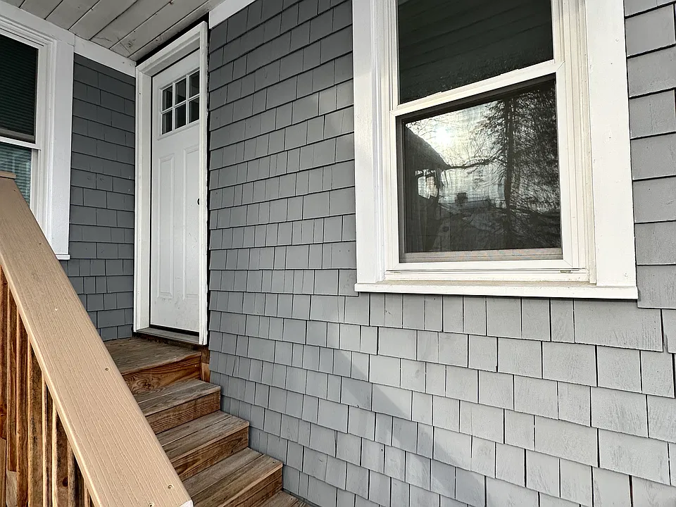 Second floor entrance from the rear of the property where there is two off street parking spaces.