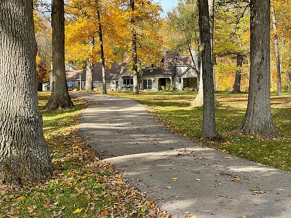 Imagine driving home to a tranquil home set on a three acre wooded light