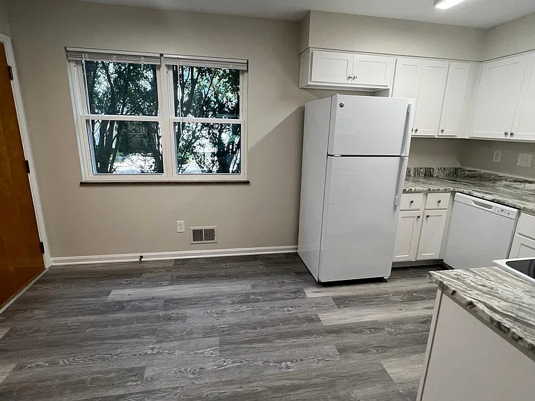 Dining area in kitchen with rear exterior door to off street covered parking