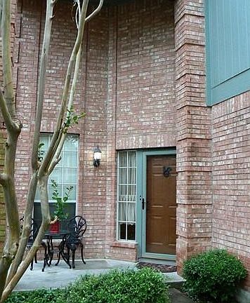 Tall entry way with patio area.