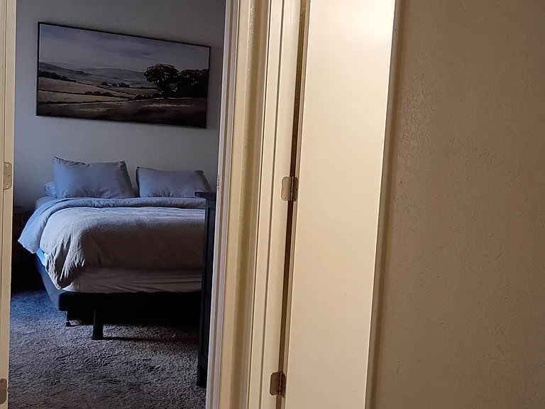 First floor bedroom with 1 of 2 baths to the right