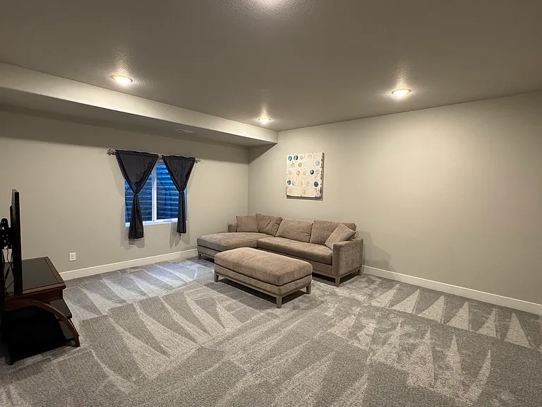 Private Basement Rental Space- Living Room with TV. *includes mini-fridge, microwave and Keurig not pictured*
