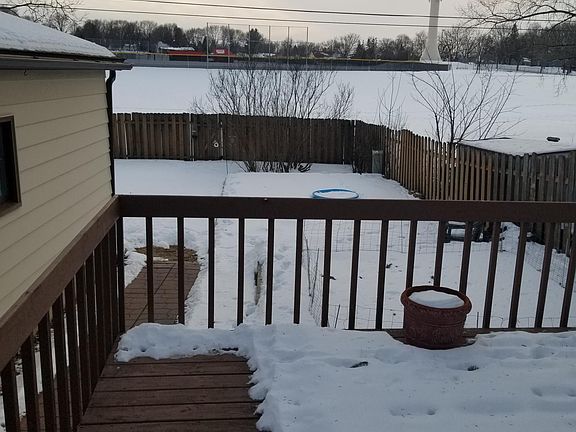 View from deck - overlooks large open space and baseball field behind the house