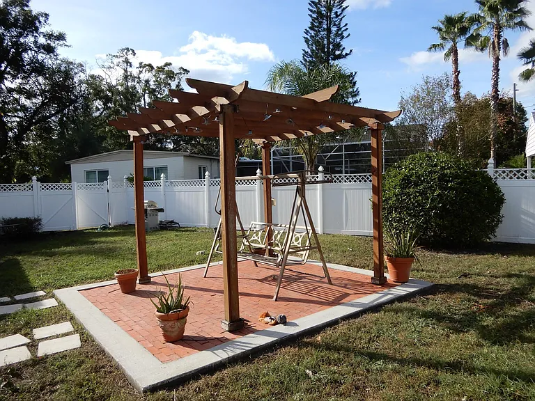 View of PVC double gate and Pergola taken from the rear of the property.