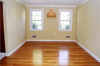 Dining room also has gleaming hardwoods