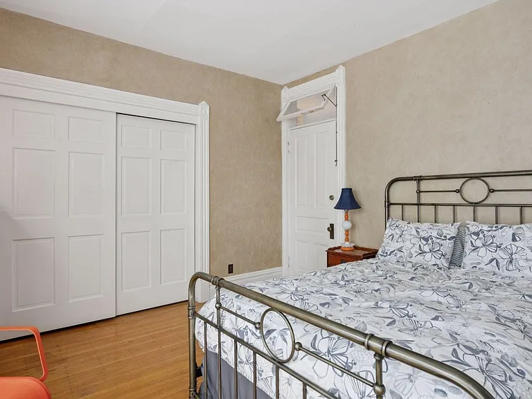 Bedroom. Plenty of space to accommodate a king bed, plus dresser, small desk, walking pad, and anything else you might need in your room. Another unobstructed view of the backyard oasis, so you can fall asleep to the sounds of the waterfall on warm nights