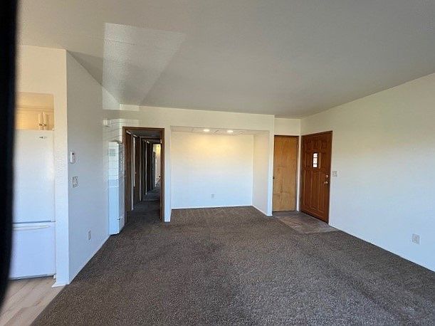 looking at entrance of apartment on right, hall to bedrooms on left