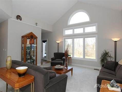 Newer windows in Great room & ledges accent this open floor plan with soaring ceilings.